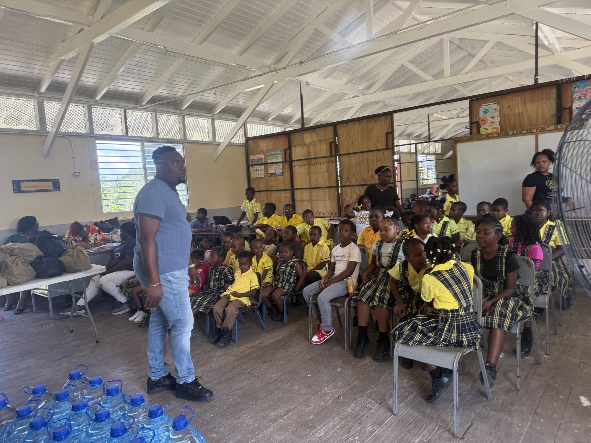 Students seated at Chatsworth Primary and Infant School during a Rise Again Jamaica Incorporated food distribution.