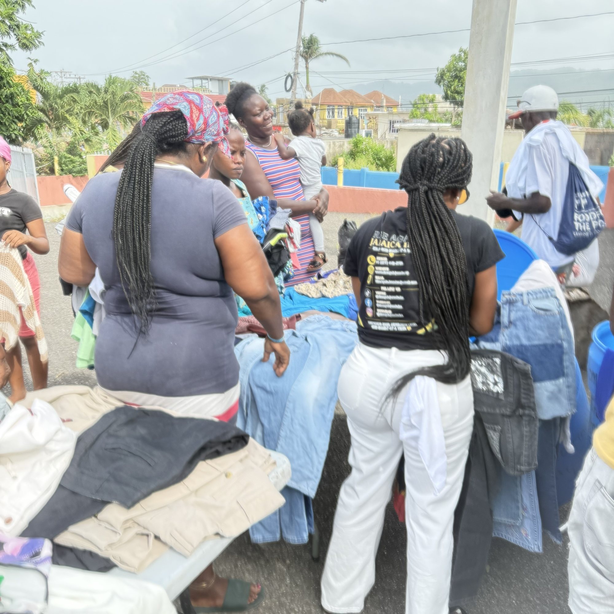 Residents choosing clothing at the Mount Salem community distribution.