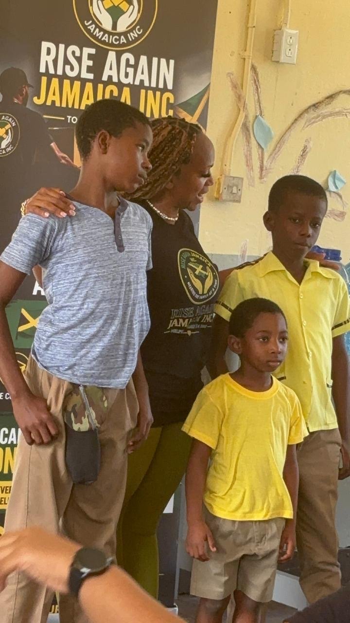 Founder Michelle Ramundo standing with students supported through the graduation sponsorship program.